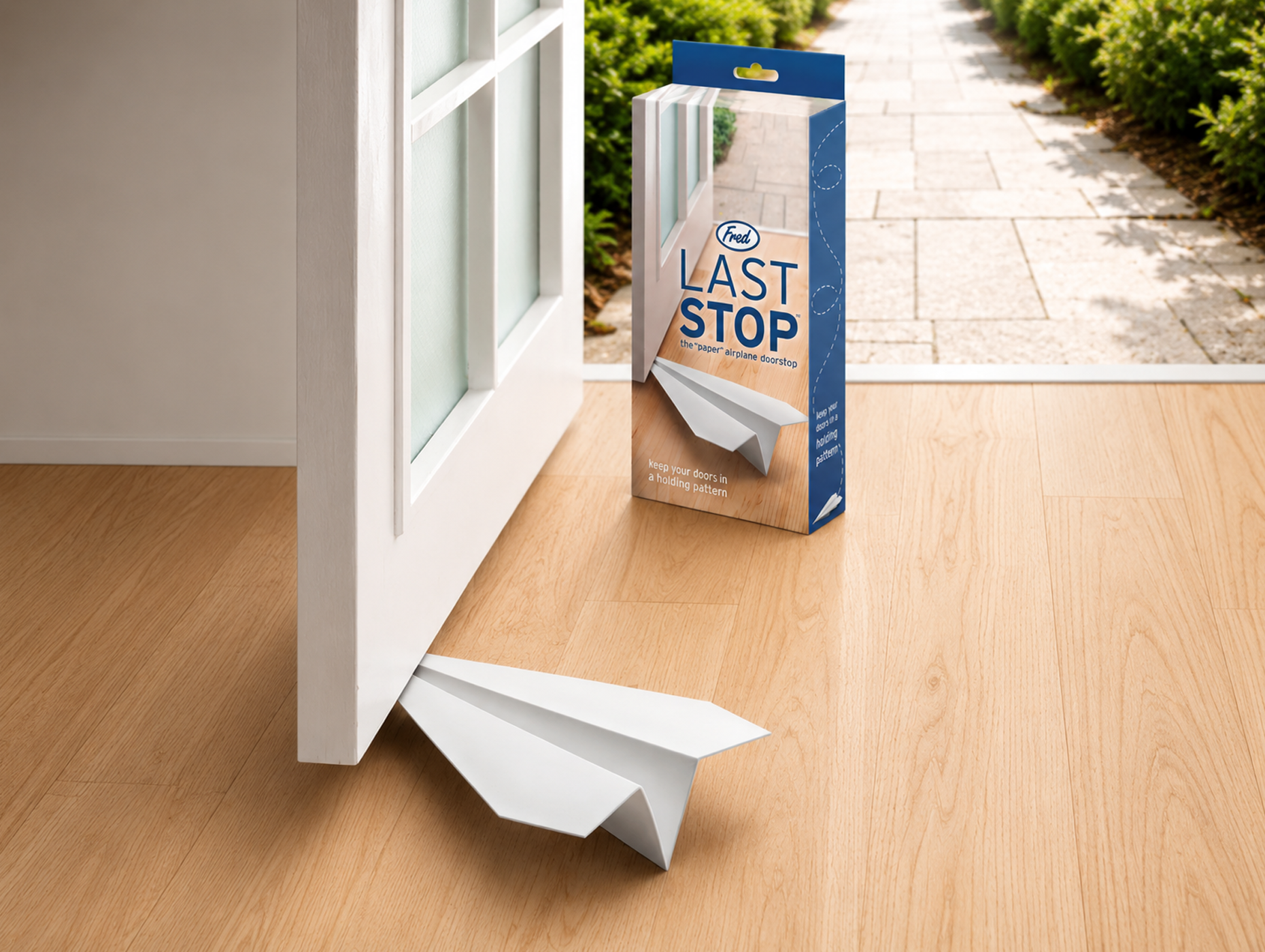 Last Stop — paper plane doorstop, Fred & Friends